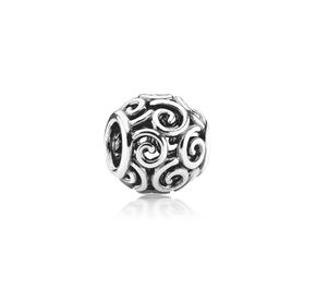 Abstract silver charm