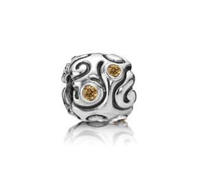 Abstract silver charm with honey cubic zirconia