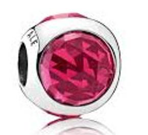 Silver charm with cerise crystal