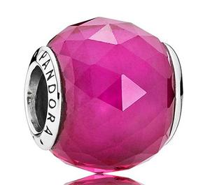 Abstract silver charm with faceted synthetic ruby